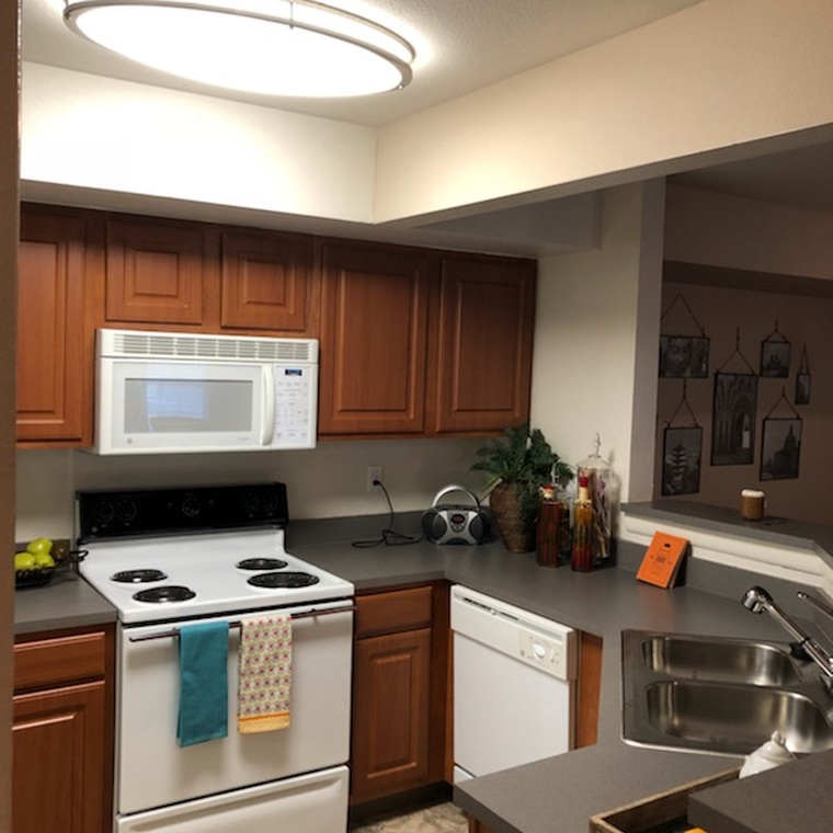 New updated cabinets in open kitchen with beautiful wrap around breakfast bar